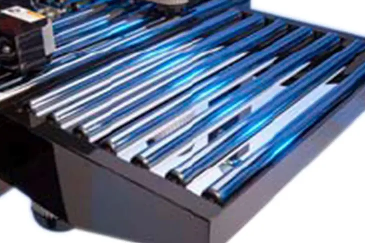 Shiny blue and silver metal roller conveyor.