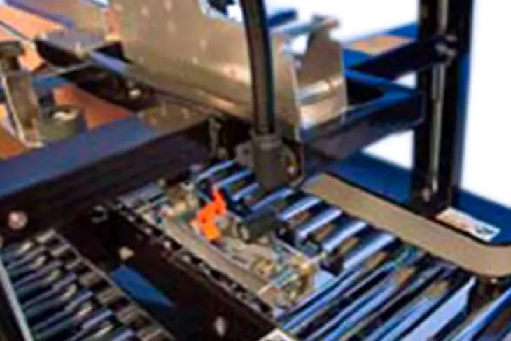 Industrial machine with conveyor belt components.