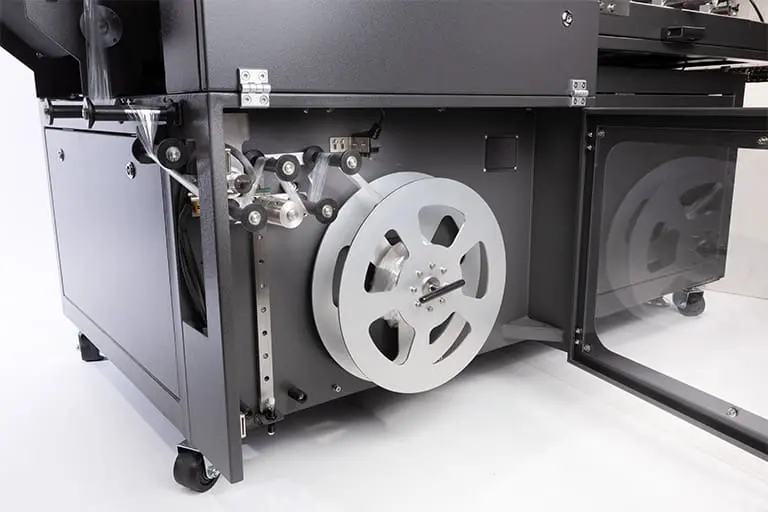 Industrial machine with large metal reel. Industrial machine with large metal reel.