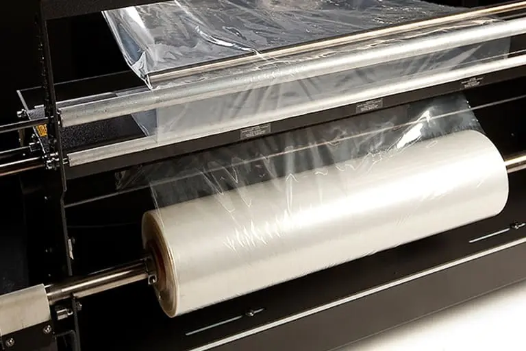 Plastic film roll on packaging machine.