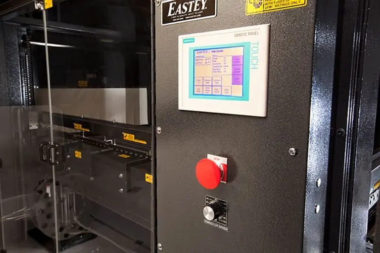 Industrial machine with touchscreen control panel.