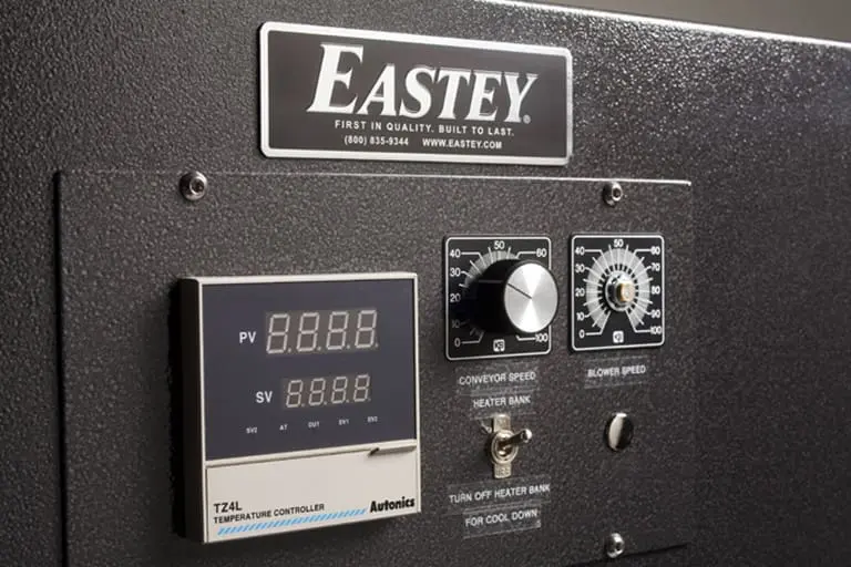 Eastey machine control panel with display and knobs.