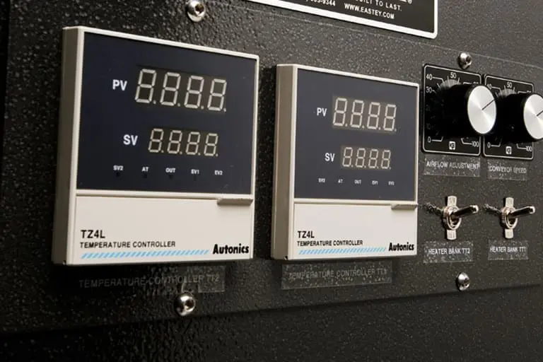 Temperature control panel with digital displays.