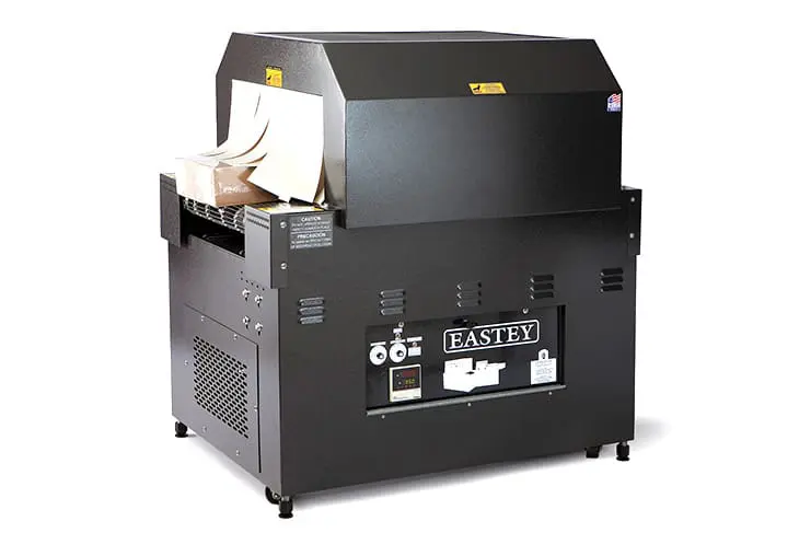 Industrial shrink wrap machine with packages.
