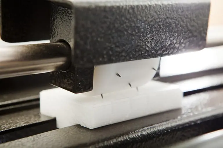 Close-up of a CNC machine in operation.