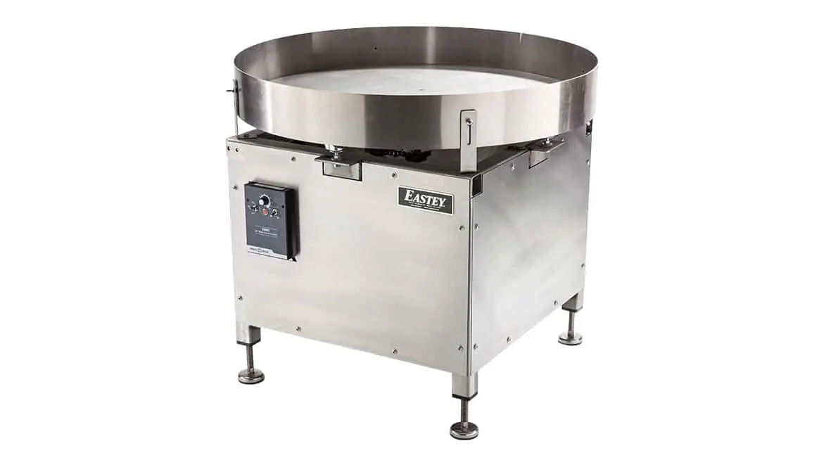 Stainless steel industrial turntable with control panel.