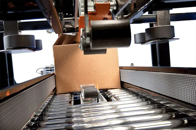 Cardboard box on automated conveyor system.