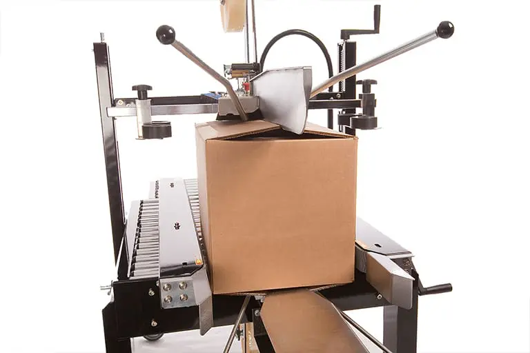 Box sealing machine with cardboard box.