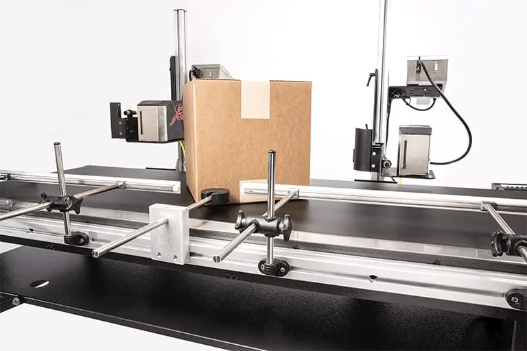 Cardboard box on industrial conveyor system.