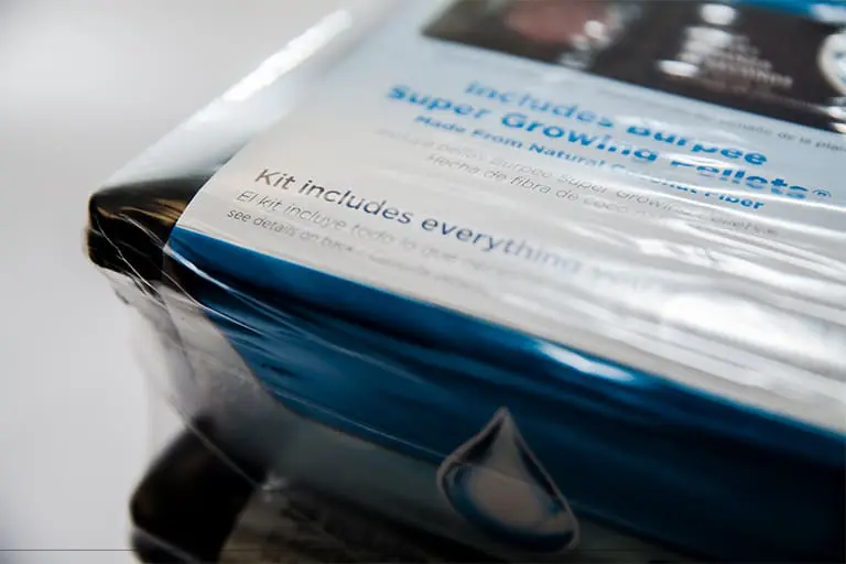Plastic-wrapped product package with visible text.