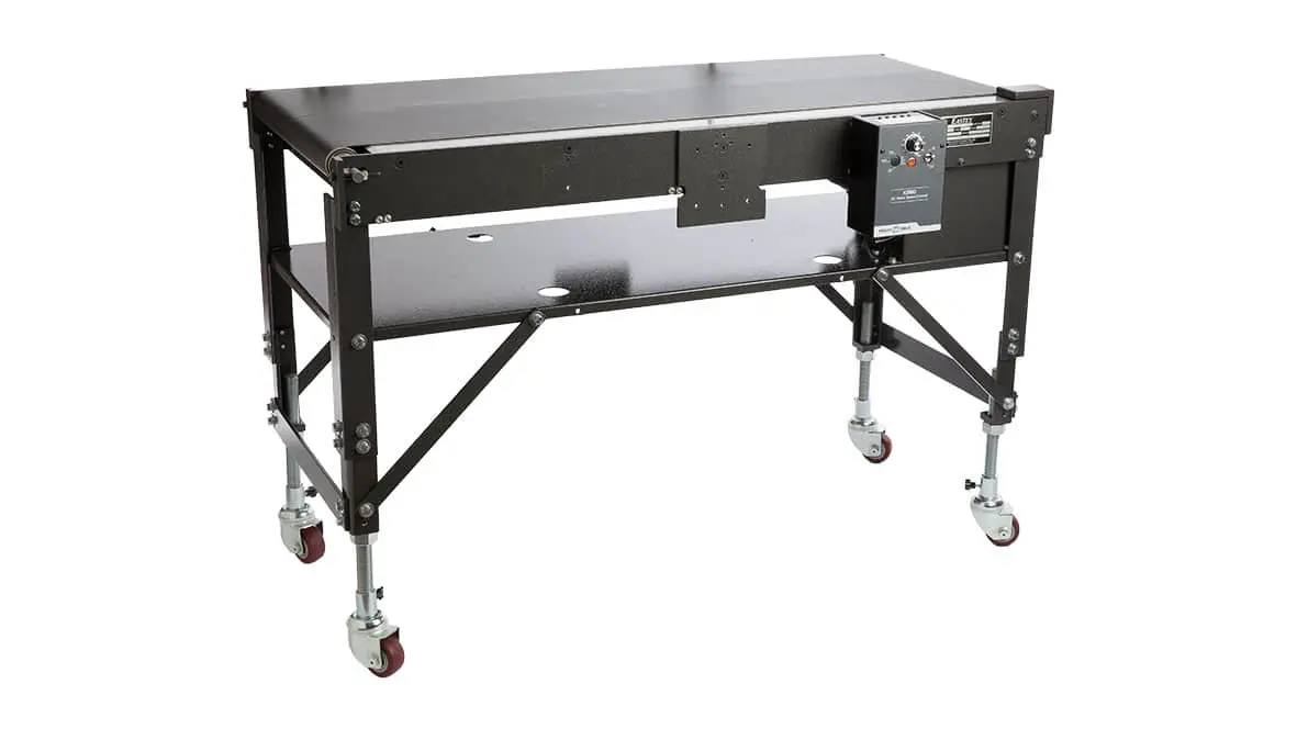 Conveyor belt machine with wheels and controls.