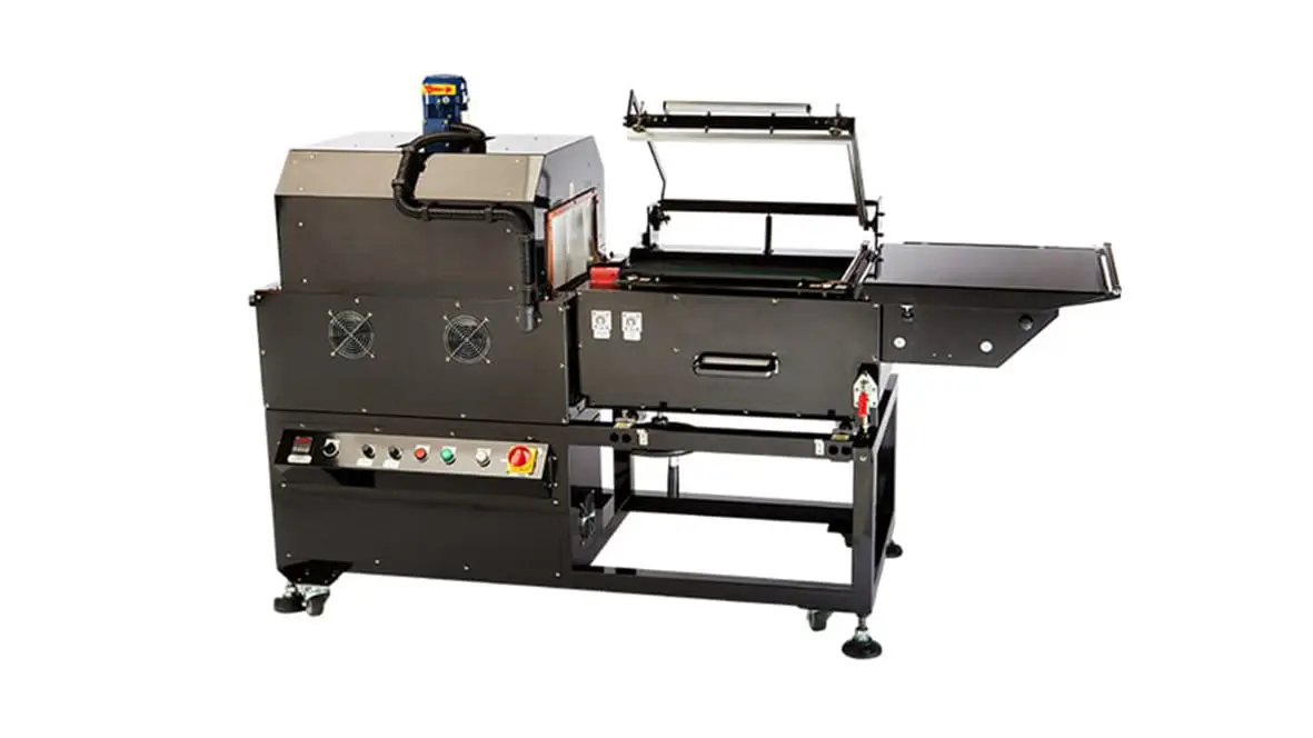 Industrial packaging machine with conveyor system.