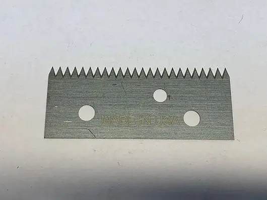 Serrated utility blade with holes, Made in USA.