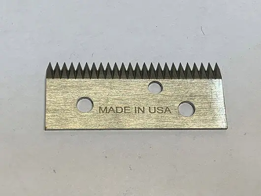 Metal blade with serrated edge, "Made in USA.
