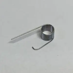 Metal coil spring on white background.