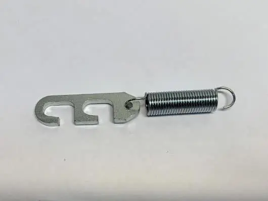 Metal hook with spring on white background.