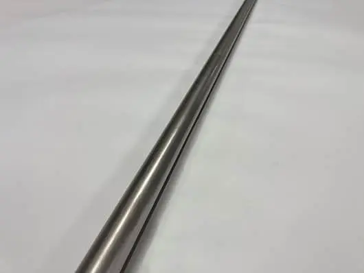 Here's an alt tag for the image: Long, silver metal rod.