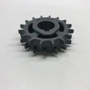 Gray plastic gear with center hole.