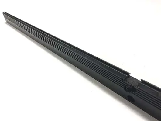 Black windshield wiper blade on white background.
