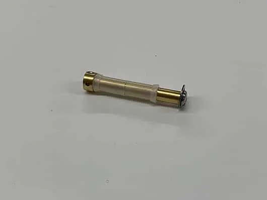 Small cylindrical metal and plastic component.