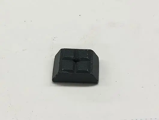 Black square part with center hole.