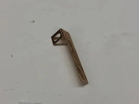 Gold-colored metal electrical connector.