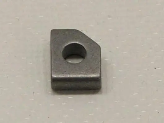 Metallic square with central circular hole.