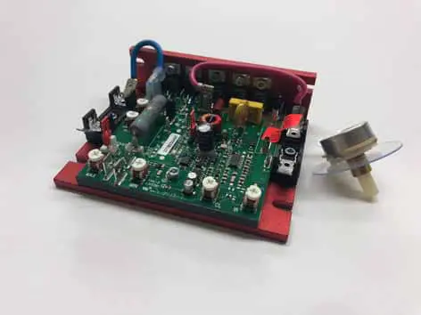 Red motor control circuit board with potentiometer.