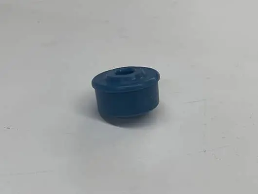 Blue plastic cylindrical part.