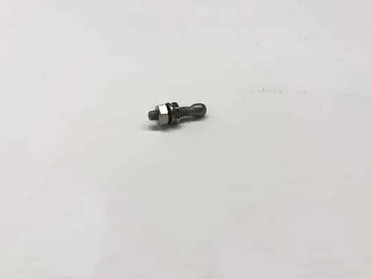 Small metal bolt on white background.
