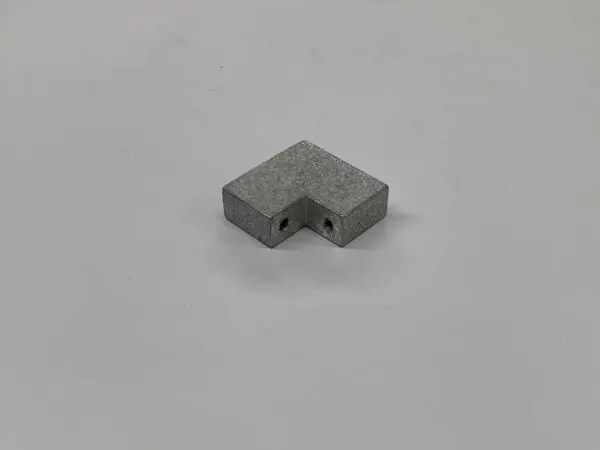 Metal L-shaped bracket on white background.
