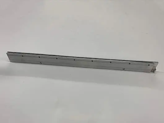 Metal rail with holes on white background.