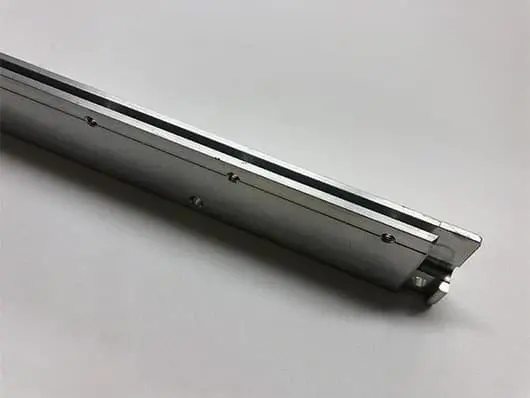 Metal linear rail on white background.