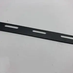 Black metal strip with cutouts.