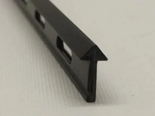 Black plastic arrow-shaped trim piece.