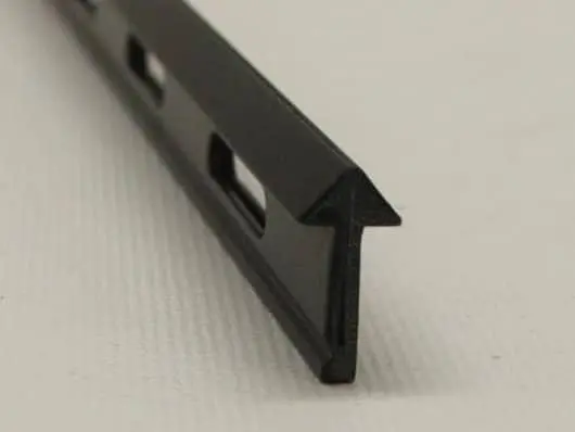 Black plastic edge trim with slots.