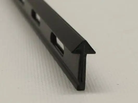 Black metal T-track on white background.
