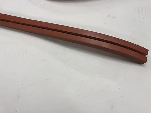 Two brown rubber strips on white background.
