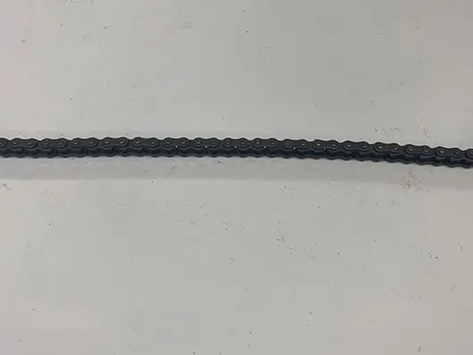 Black roller chain on white background.