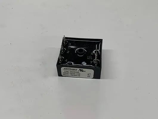 Black relay with numbered terminals.