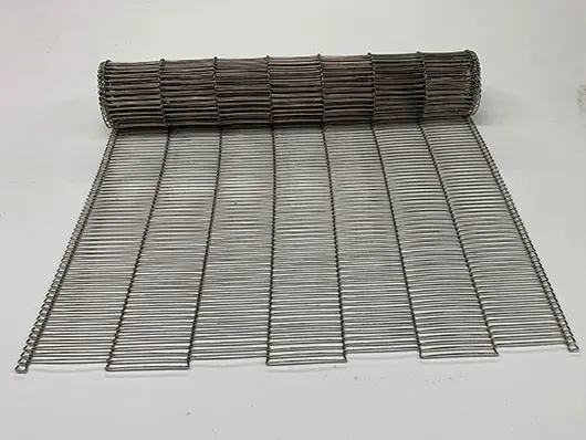 Rolled metal wire mesh on white background.