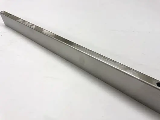 Metallic rectangular bar on white background.