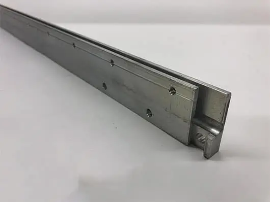 Metal sliding drawer rail on white background.
