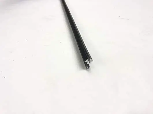 Black triangular-shaped metal connector.