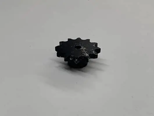 Black gear on a white background.
