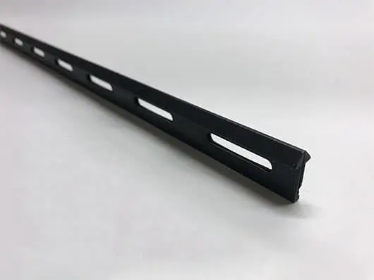 Black plastic slotted channel strip.