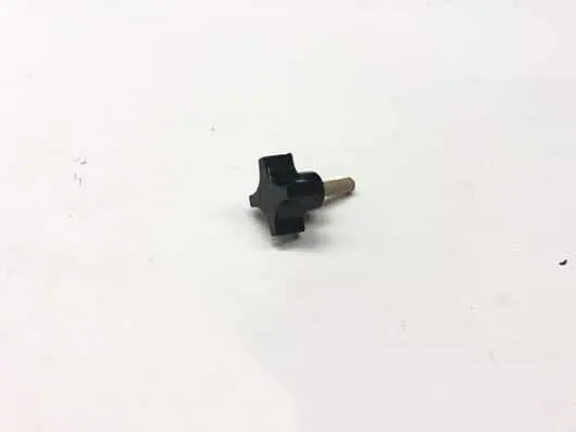Black plastic four-prong knob.