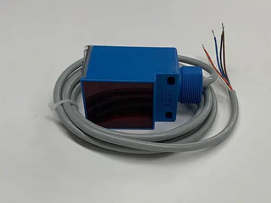 Blue sensor with attached gray cable.