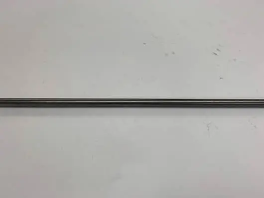 Here's an alt tag for the image: Long, dark gray metal rod.