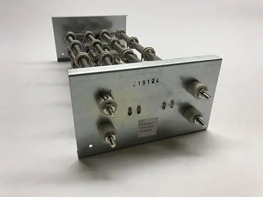 Metallic electrical component with coiled wires.